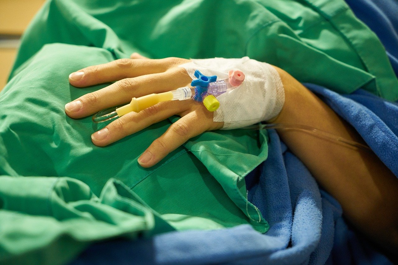 Healthcare in times of coronavirus pandemic, close-up of a hand with a peripheral venous access catheter 
