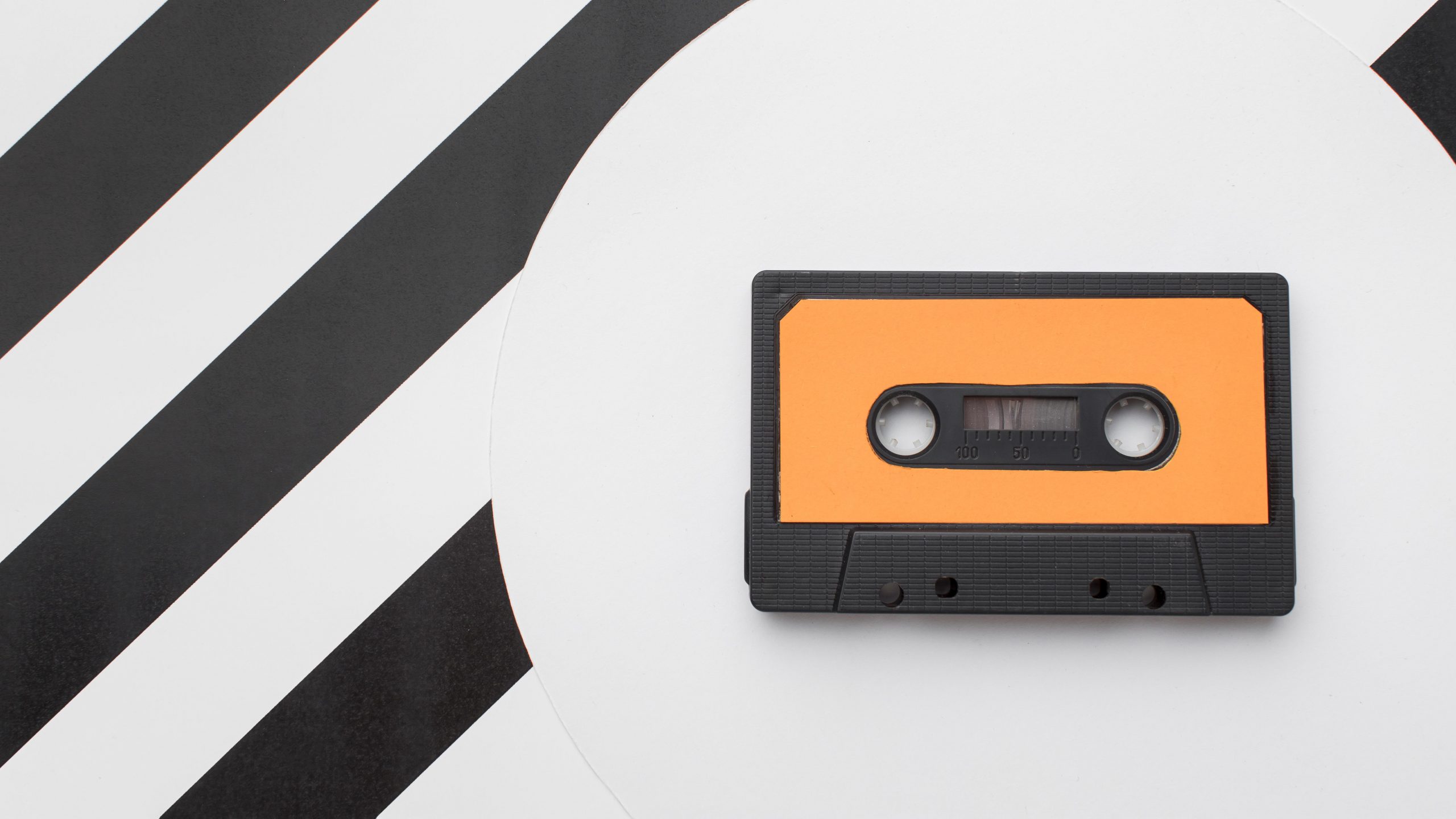 Vintage cassette tape on a modern background as main photo for a blog post with story of a cassette tape